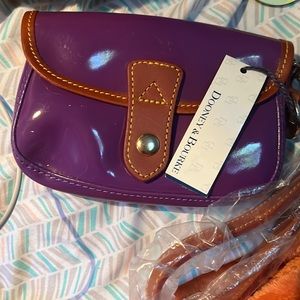 A purple Dooney & Burrle brand new wallet